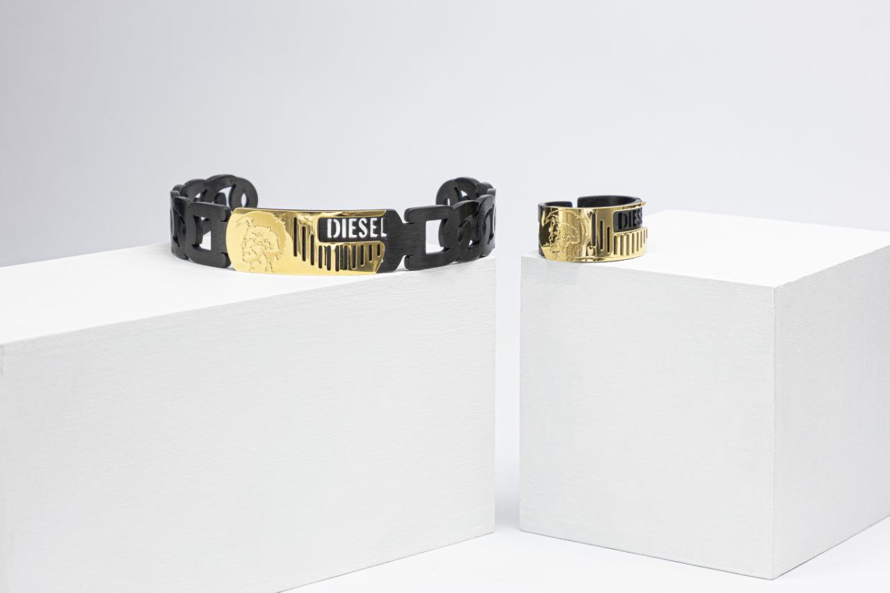 IMG_20250324_182852_717 ست دستبند و انگشتر Diesel استیل خارجی رنگ مشکی طلایی - Image 1