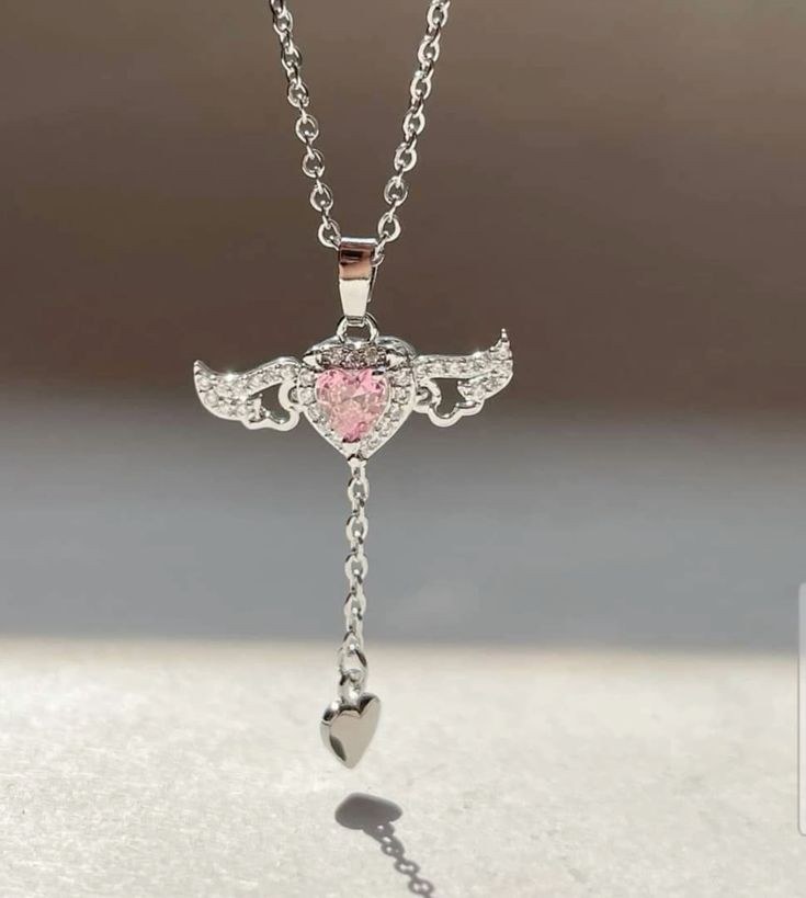 QtmfzJ9_eF65EAud.jpg گردنبند بال متحرک سوارسکی نقره ای استیل - Image 1